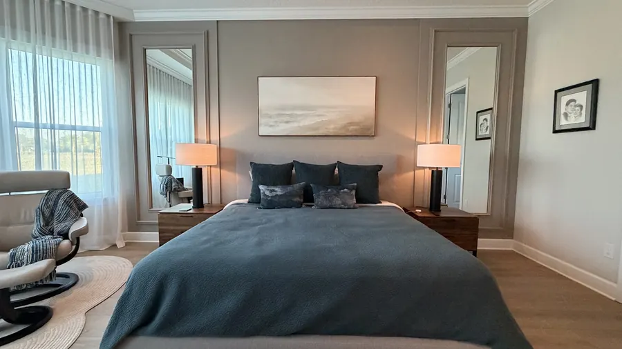 Bedroom accent wall with tall framed panels and molding